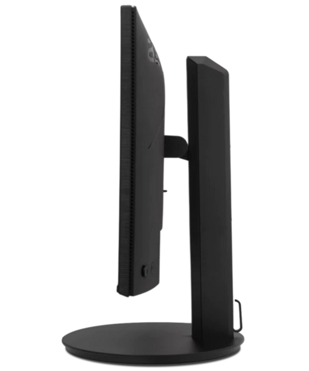 Un monitor di computer nero su un supporto rotondo, visto di lato.