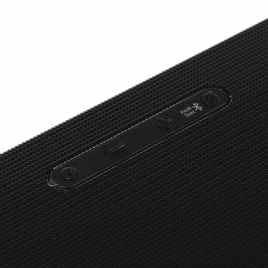 Close-up of black buttons on a textured surface.