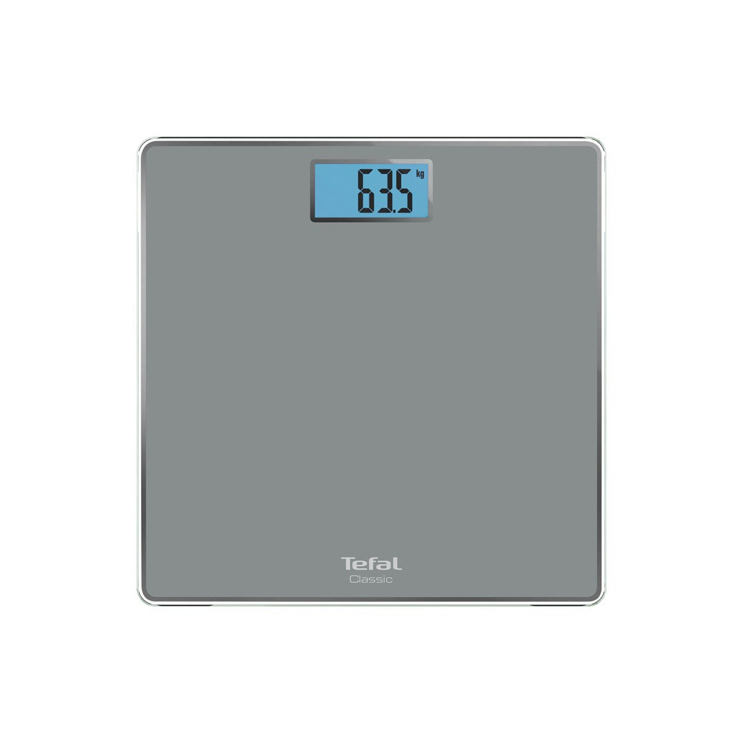 Gray digital scale with blue display showing 63.5 kg. Tefal Classic logo.