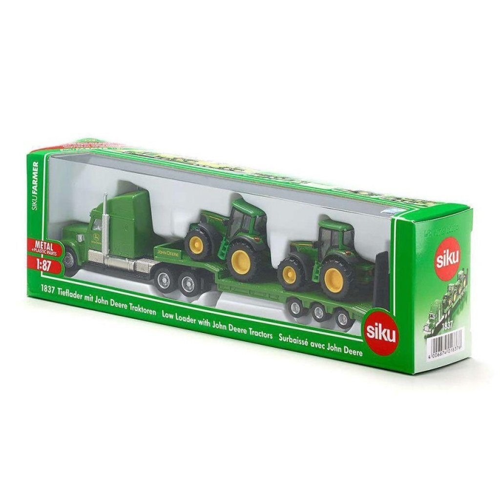 Zielona przyczepa Siku z trzema traktorami John Deere w pudełku.