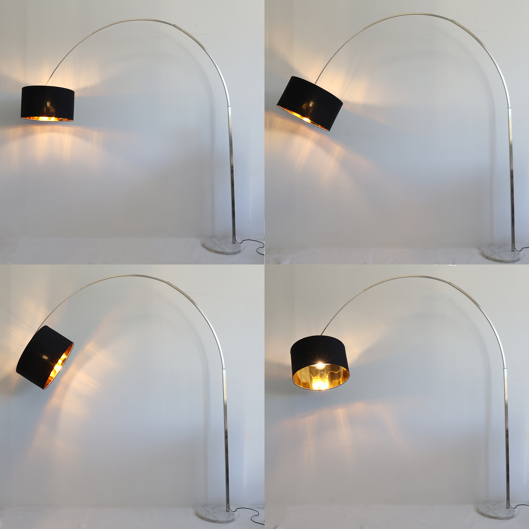 Una lámpara de pie arqueada de metal con pantalla negra y interior dorado.