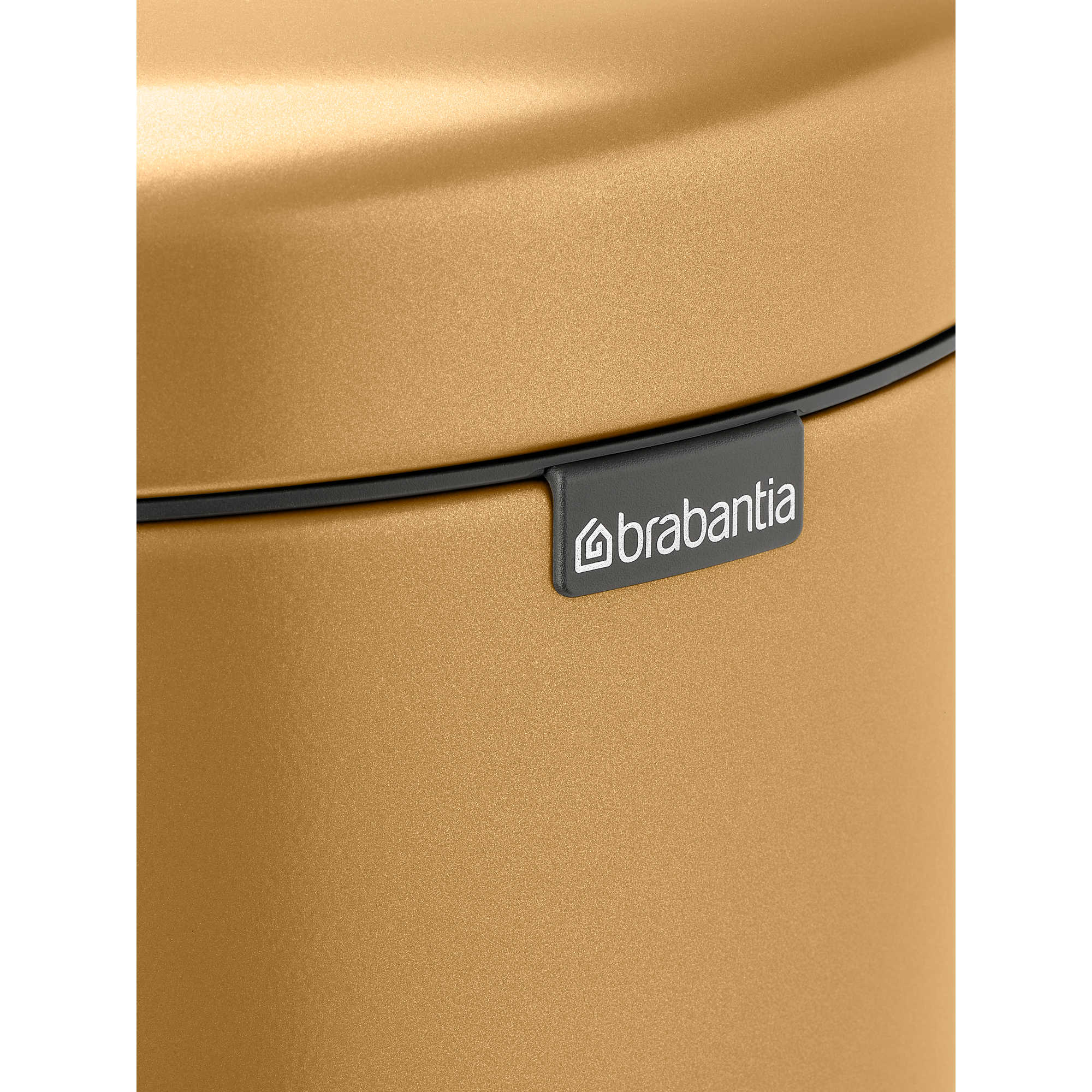 Gouden Brabantia prullenbak oppervlak met zwarte rand en logo.