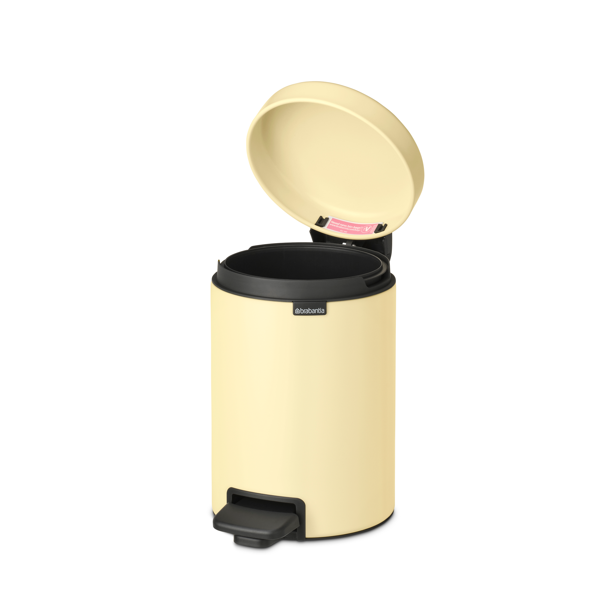 Papelera Brabantia beige con tapa abierta y pedal.