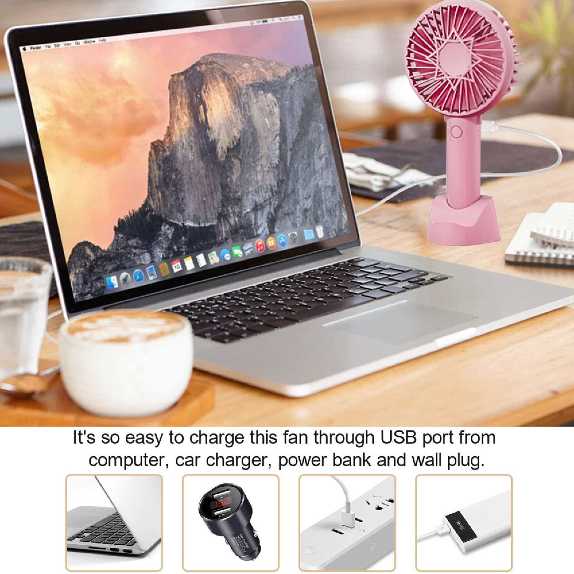 Ein Laptop, eine Kaffeetasse, ein Glas Wasser und ein rosa USB-Ventilator.