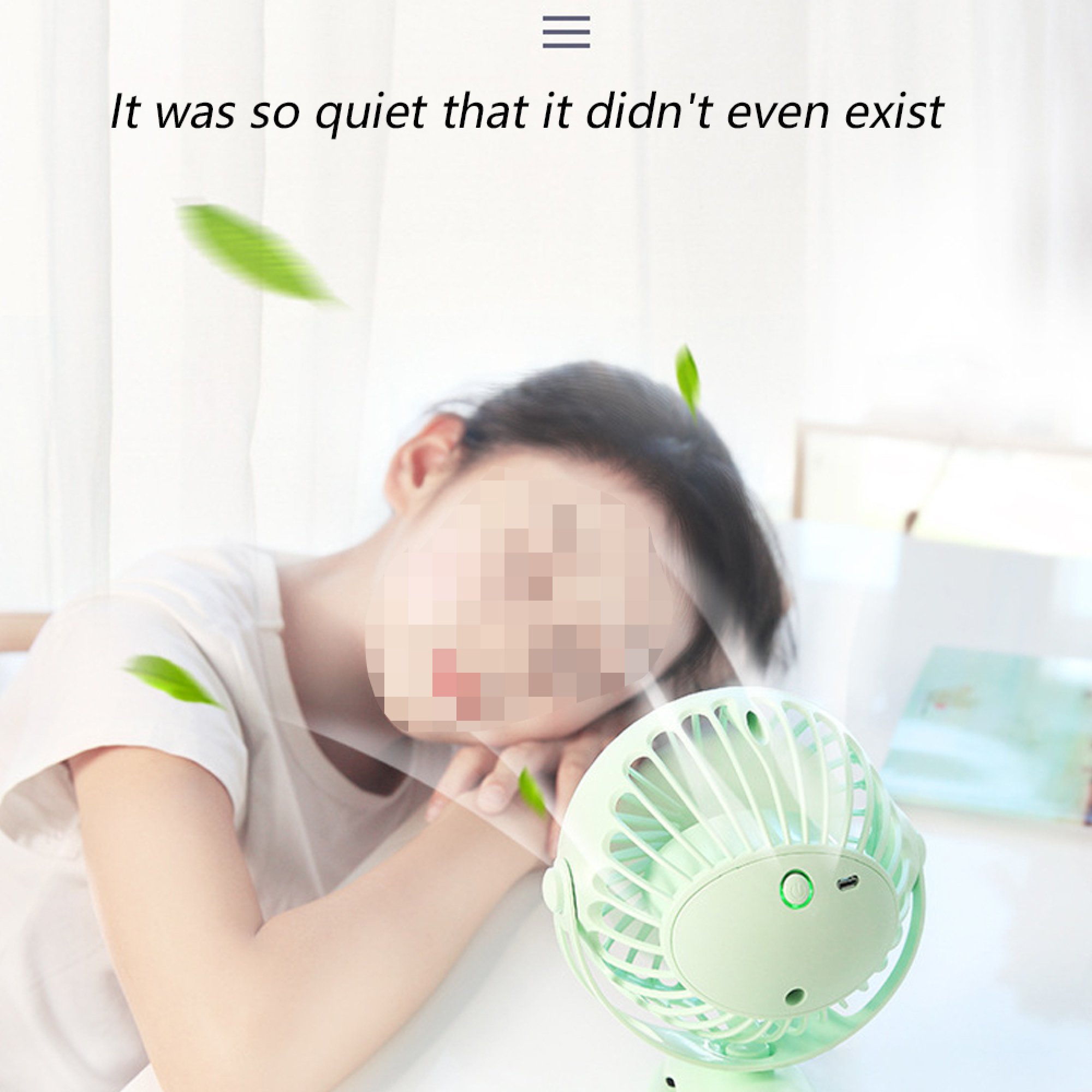 Eine Person schläft neben einem kleinen grünen Ventilator, umgeben von Blättern.