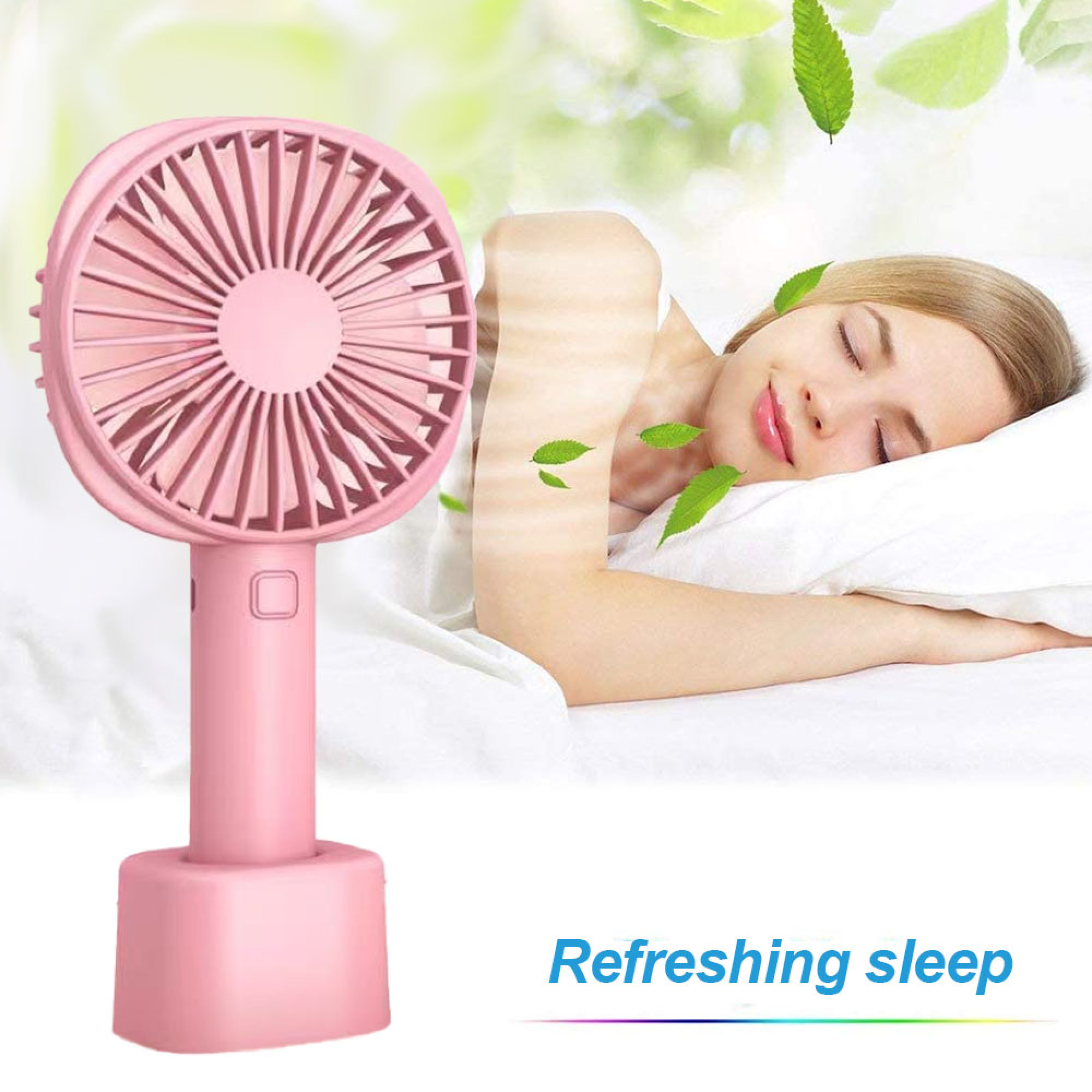 Ein rosa Ventilator steht neben einer schlafenden Frau auf einem Bett.