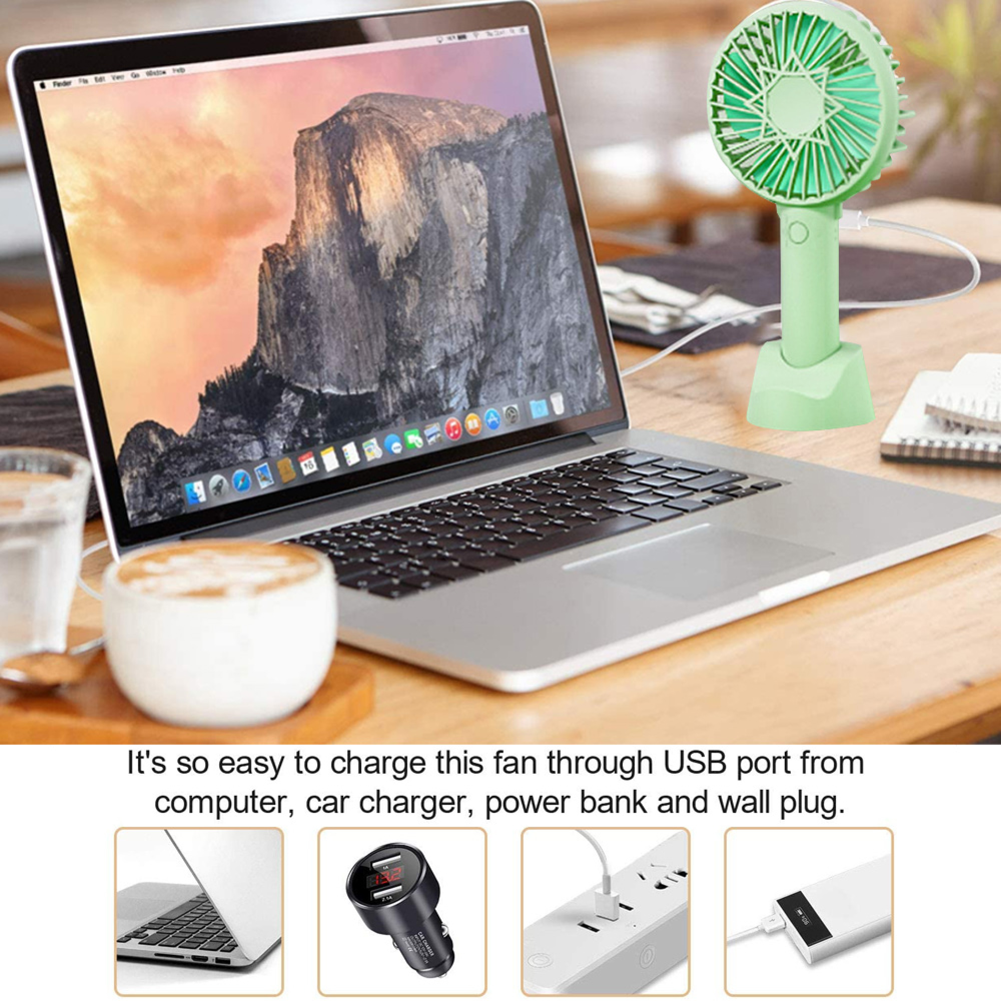Ein Laptop mit Berg-Hintergrund, eine grüne Handventilator-Ladestation und Kaffee.