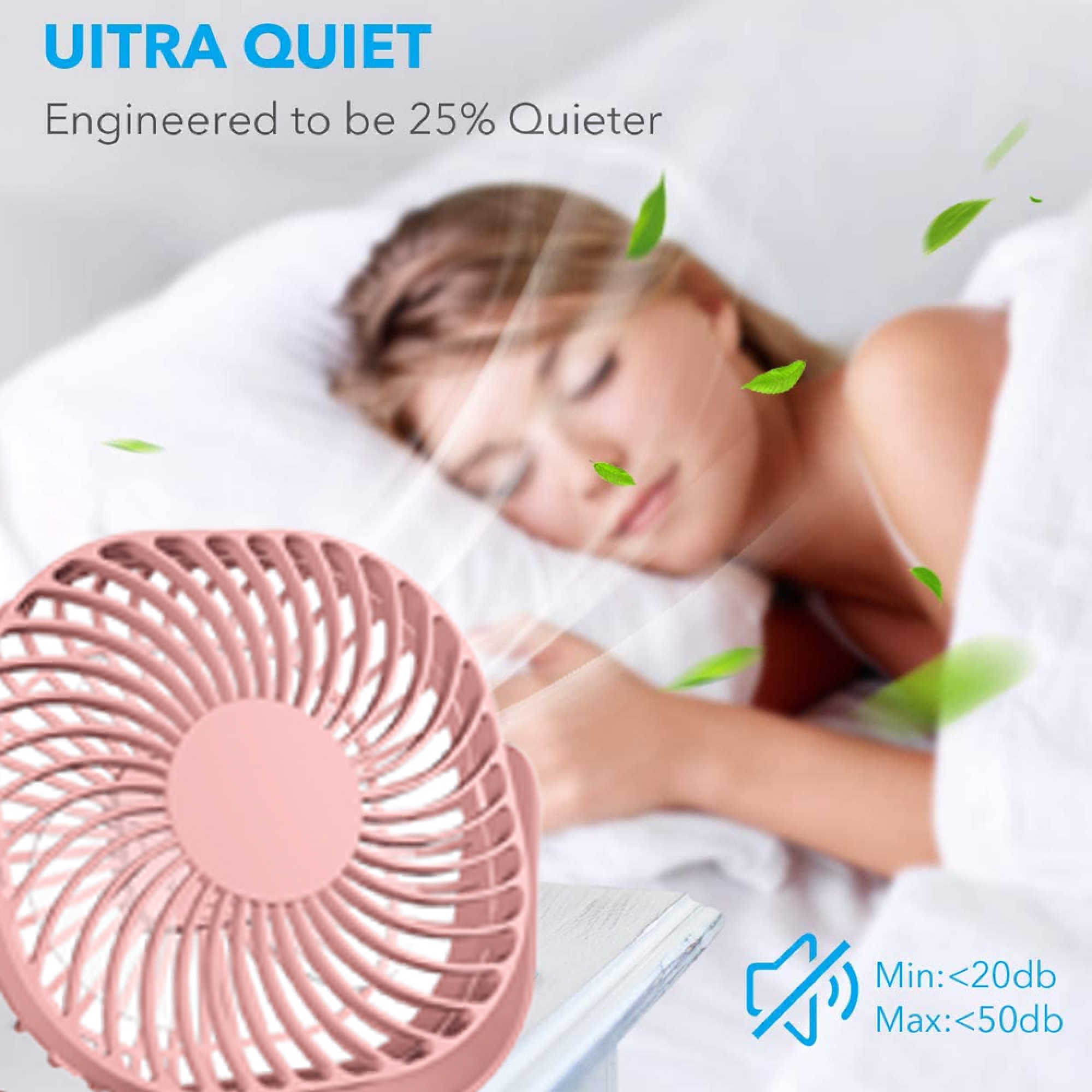 Ein rosa Ventilator steht neben einer schlafenden Person, die von Blättern umgeben ist.