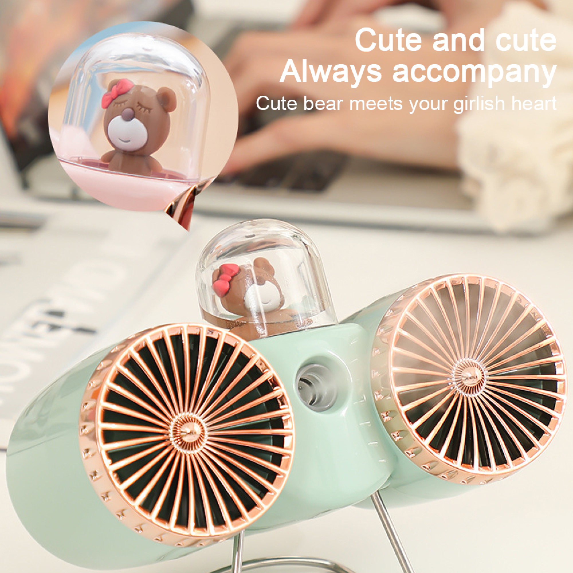 Ein mintgrüner Ventilator mit zwei Lüftern und einem süßen Bären im oberen Teil.