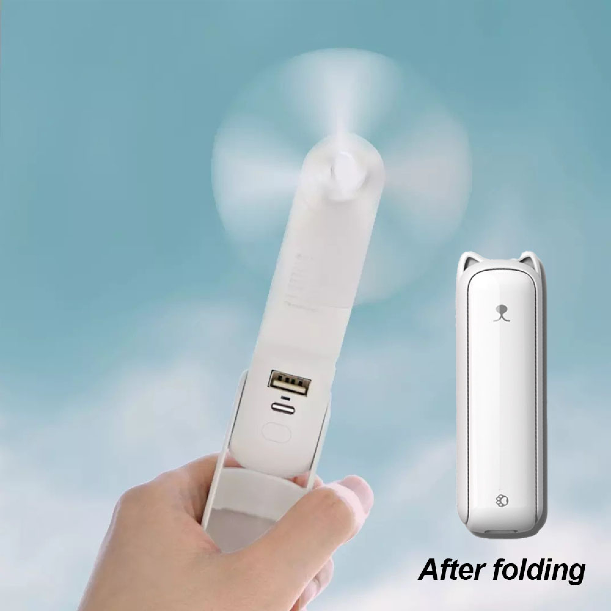 Ein weißer Handventilator mit USB-Anschluss wird in einer Hand gehalten. Daneben ein zusammengeklappter Lüfter mit Katzenohren.