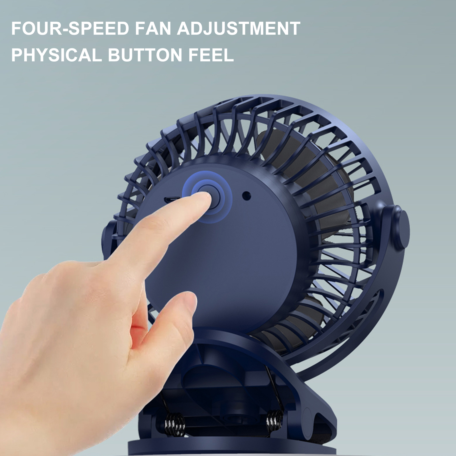 Ein Finger drückt auf den blauen Knopf eines blauen Ventilators.