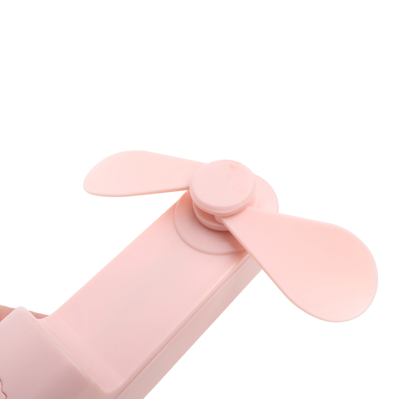 Ein kleiner, rosafarbener Ventilator mit zwei Blättern auf weißem Hintergrund.