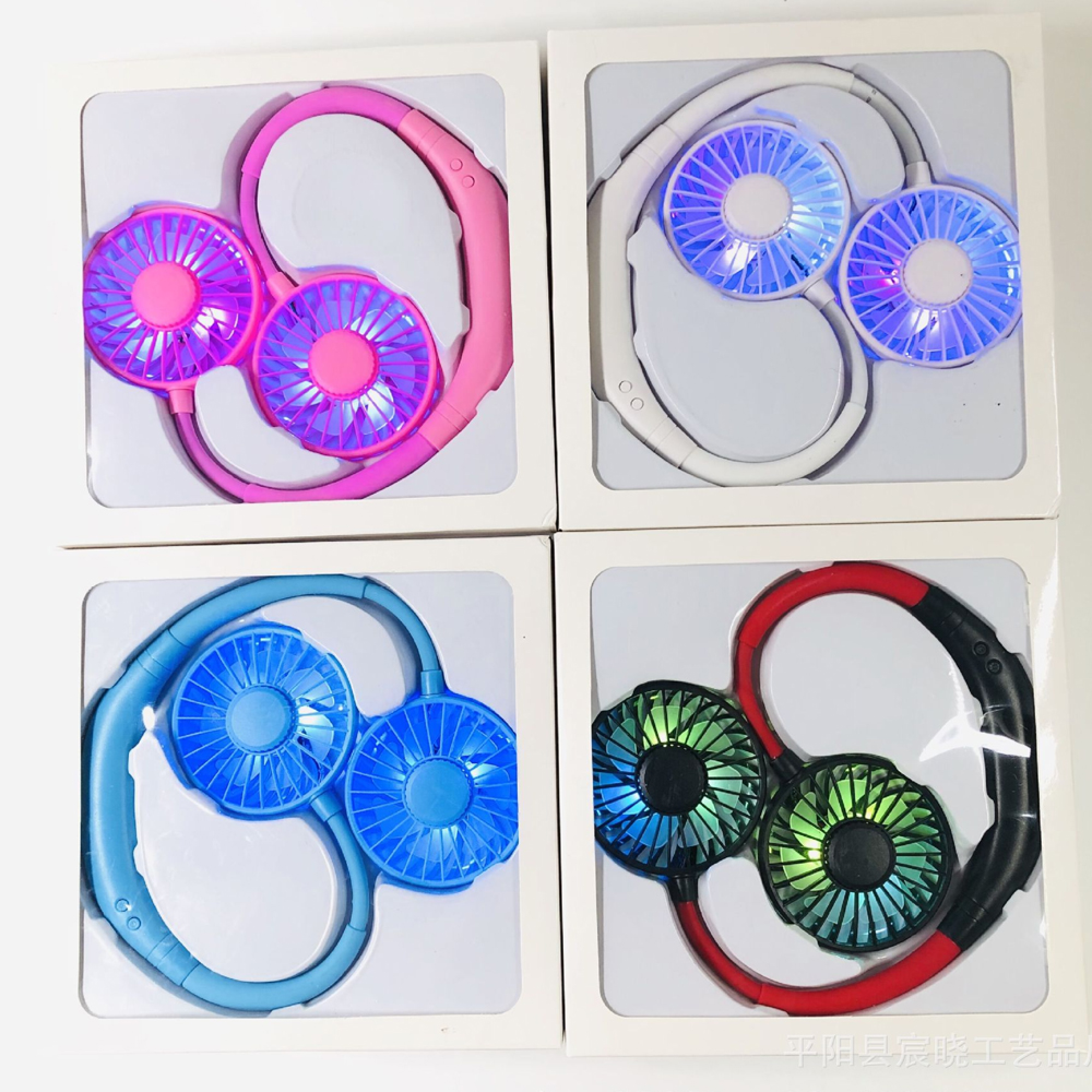 Vier Nackenfächer in Verpackungen: rosa, weiß, blau und rot/schwarz.
