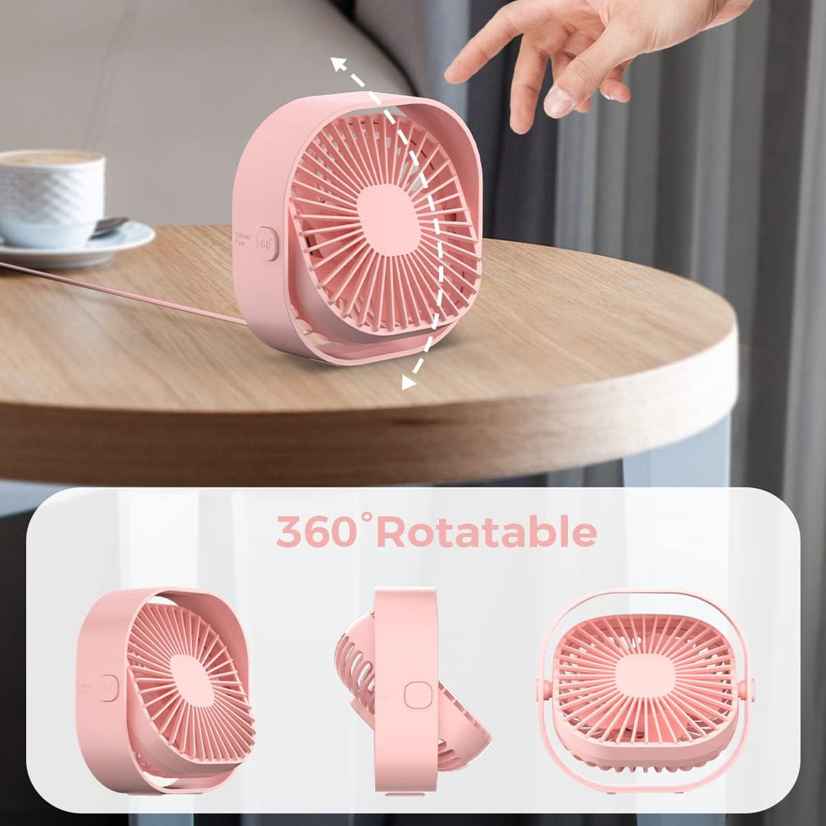 Ein kleiner rosafarbener Ventilator auf einem Holztisch, der um 360 Grad drehbar ist.