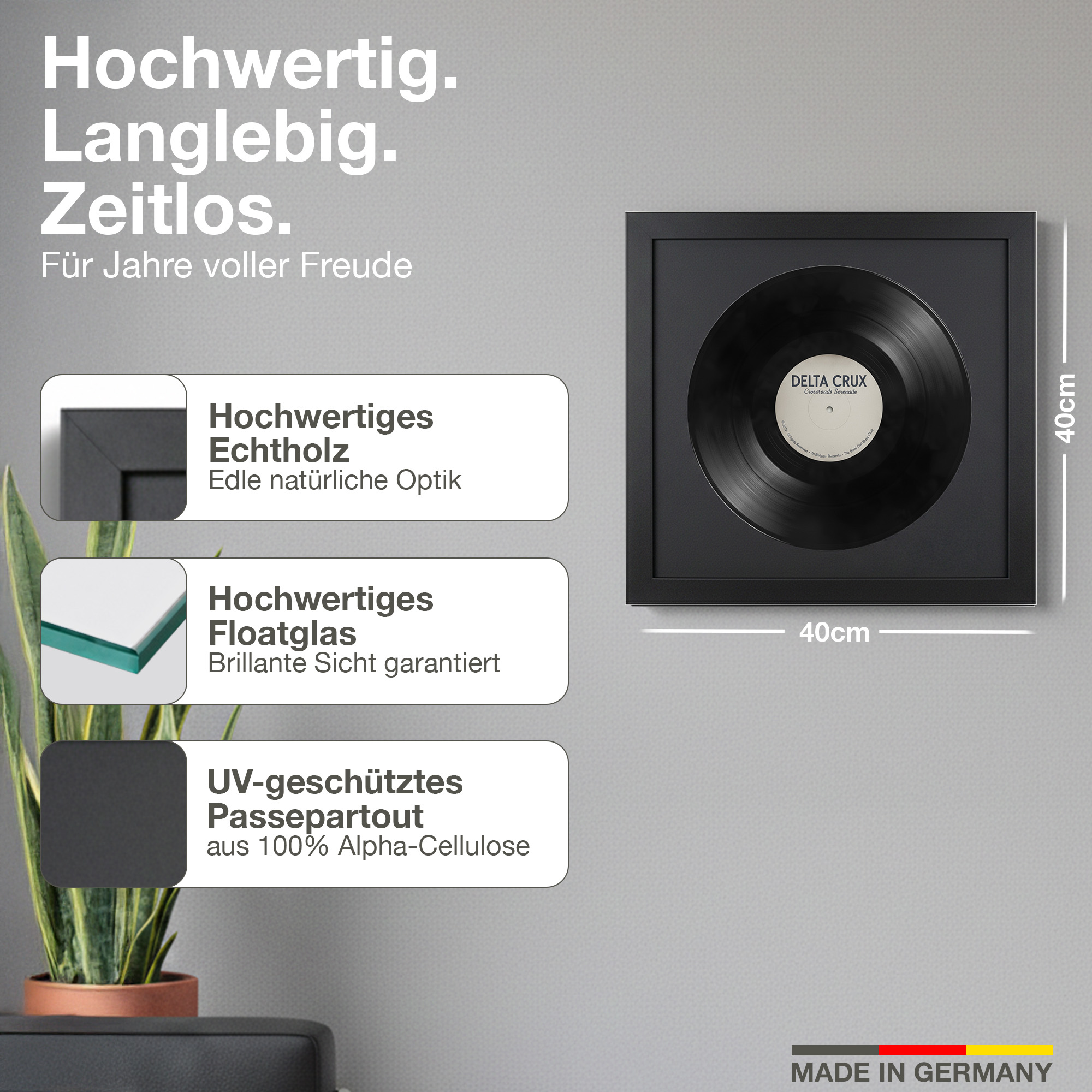 Ein gerahmtes Vinyl mit Text, 40x40cm groß, mit Pflanzen daneben.