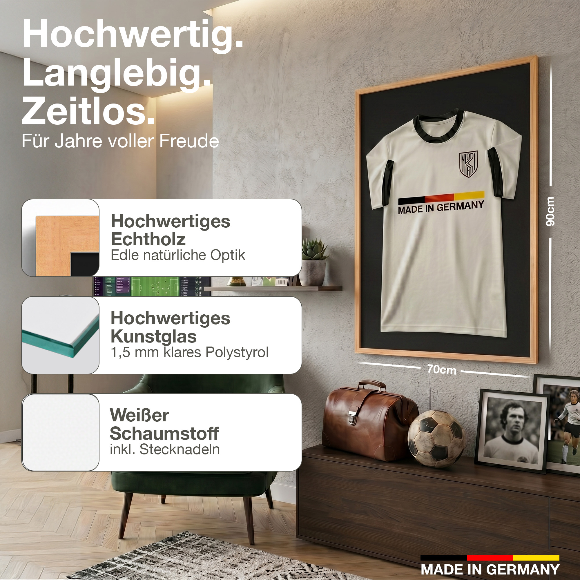 Gerahmtes Fußballtrikot mit "Made in Germany" Aufdruck, daneben Koffer, Ball und Fotos.