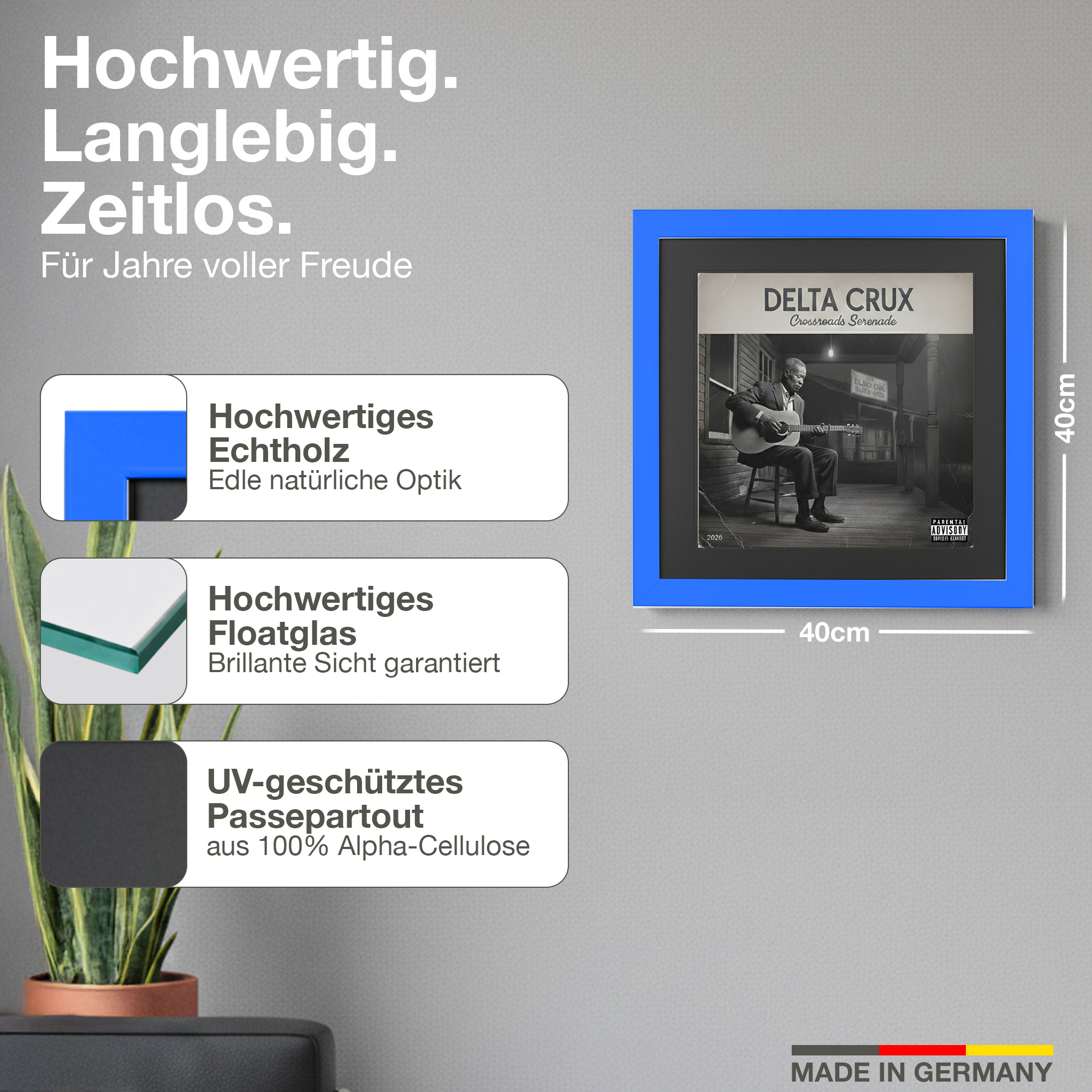 Ein blauer Bilderrahmen mit einem Albumcover eines Mannes mit Gitarre. Maße 40x40cm.