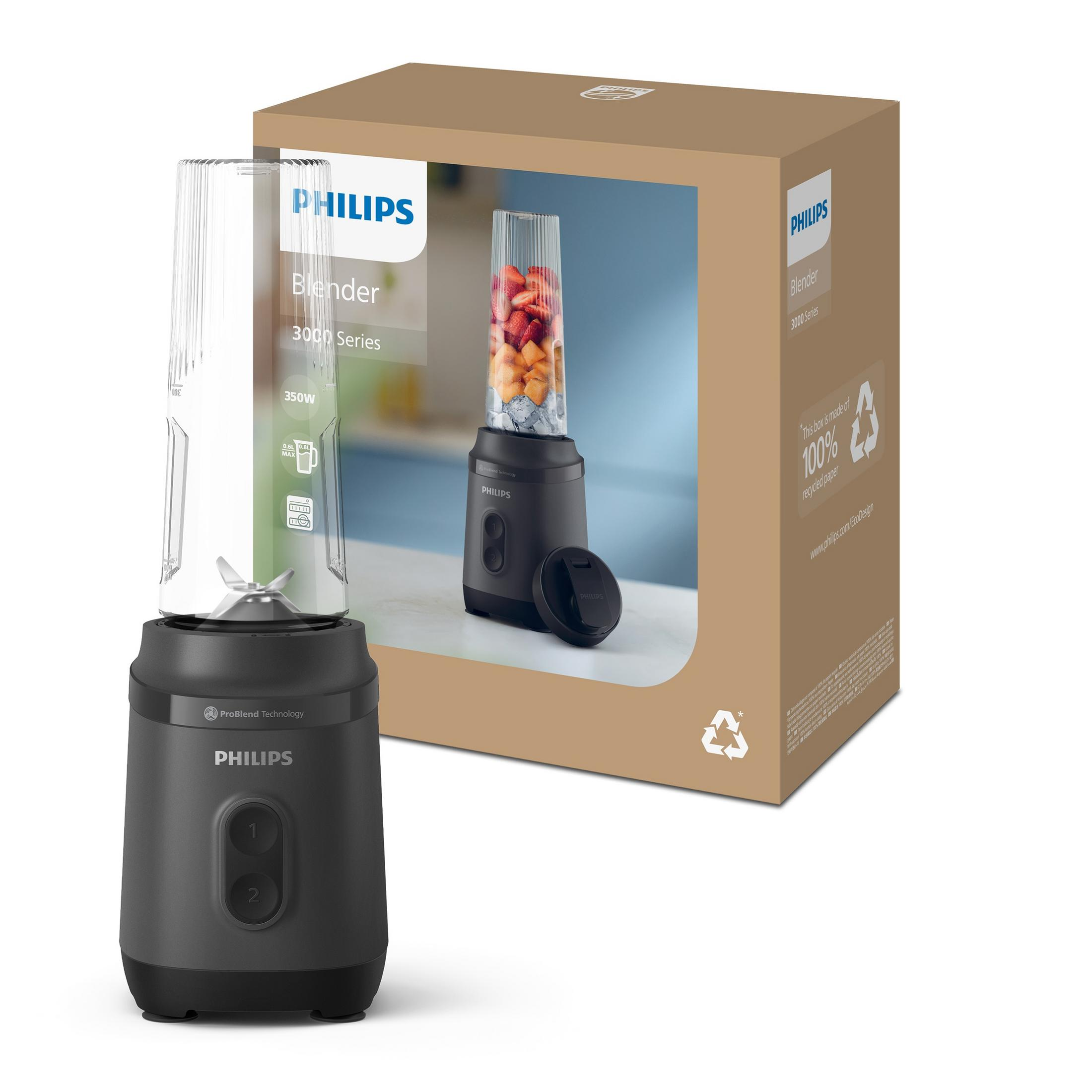 Un frullatore Philips nero con bicchiere in vetro pieno di frutta, accanto alla sua confezione.