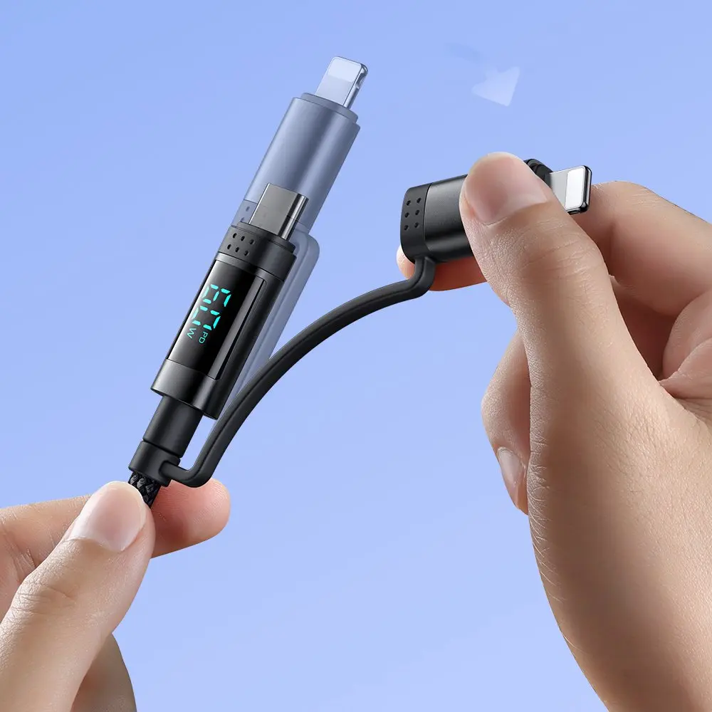 Eller, USB-C ve Lightning konnektörlü siyah bir şarj kablosu tutuyor. Dijital ekran '27W' gösteriyor.