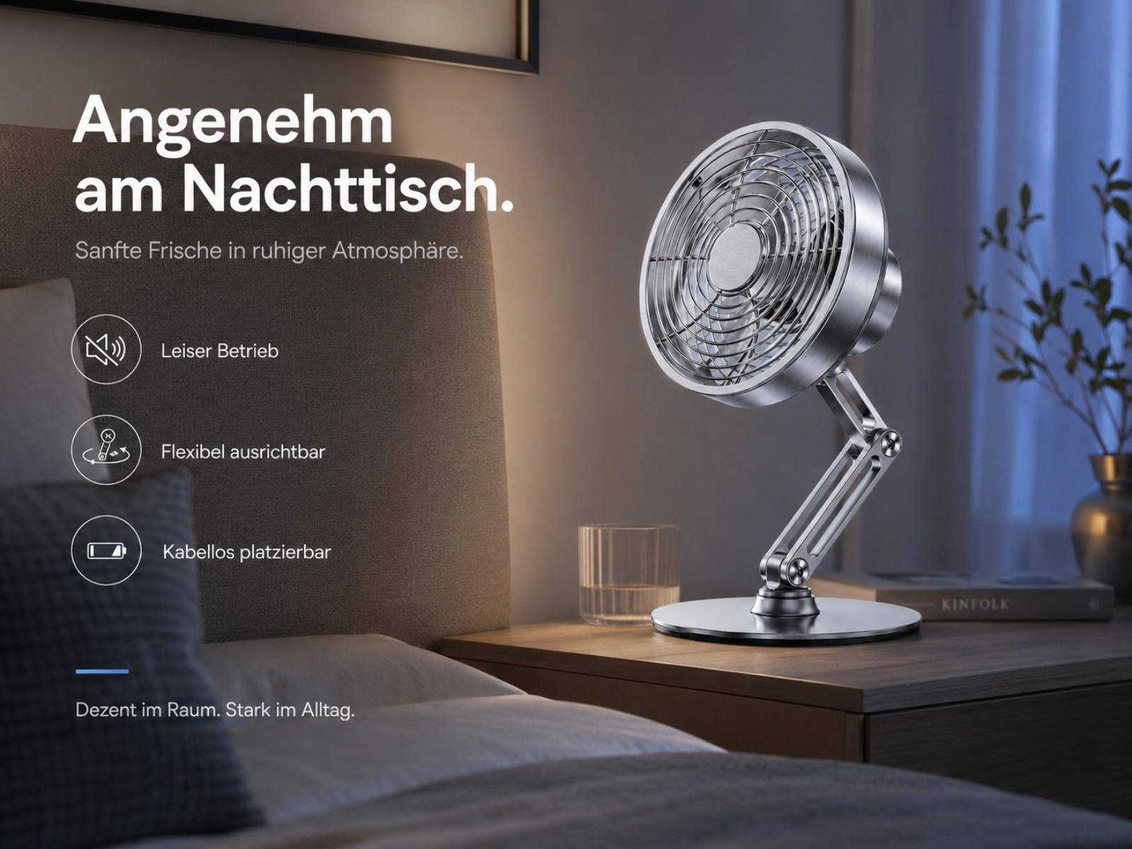 Ein silberner Tischventilator steht auf einem Nachttisch neben einem Bett.