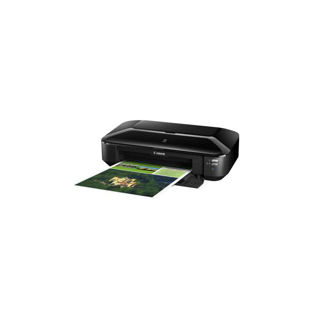 Schwarzer Canon Drucker druckt ein Bild eines Gebäudes in grüner Umgebung.