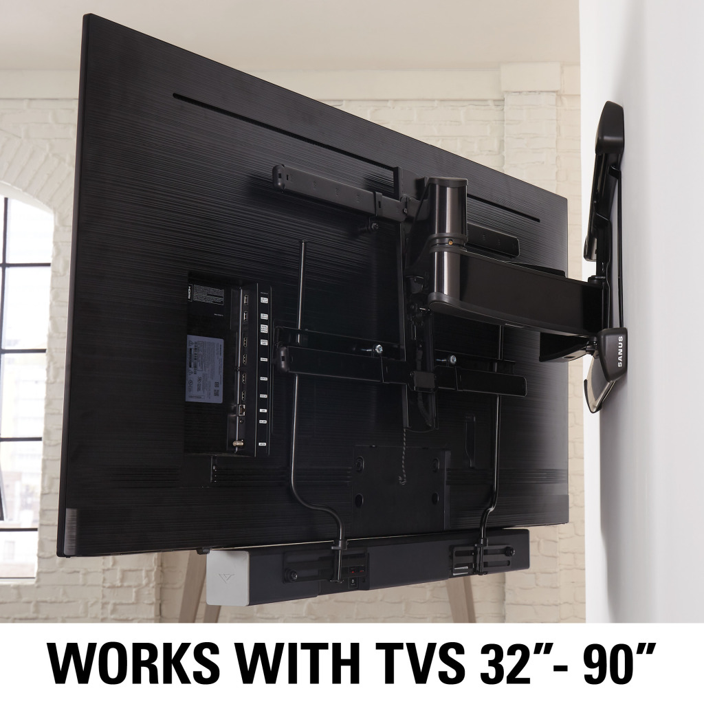 Rückseite eines Fernsehers an einer Wandhalterung, mit Soundbar darunter.