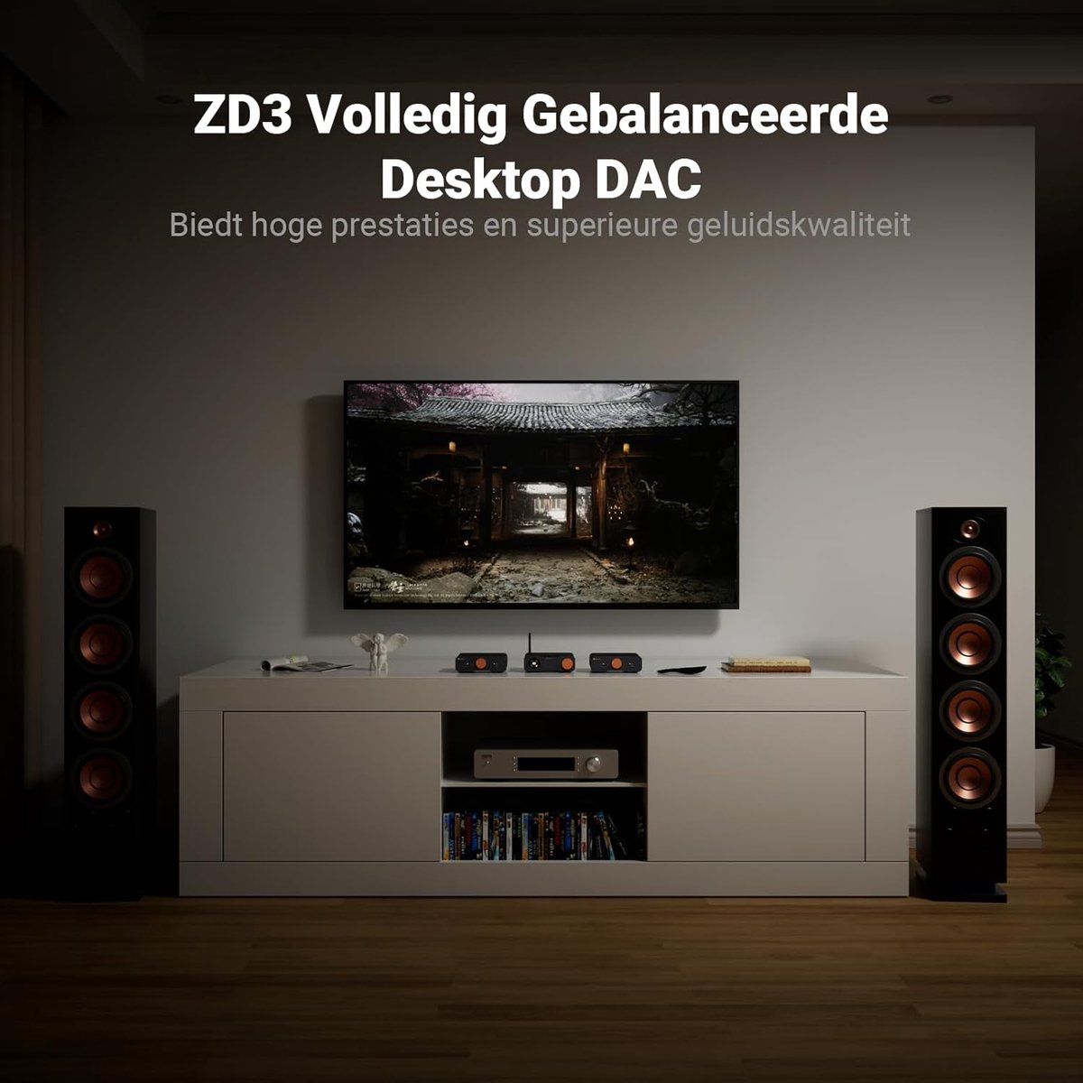 Woonkamer met tv, dac, luidsprekers en boekenkast.