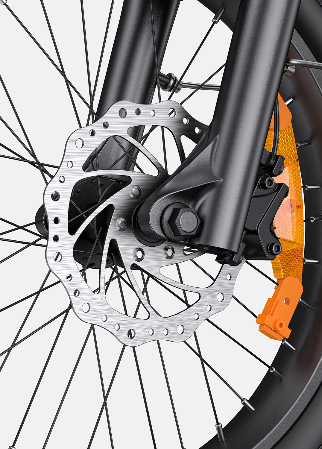 Primer plano del sistema de freno de disco de bicicleta con reflector naranja.