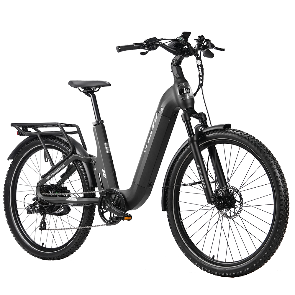 Una bicicleta eléctrica negra con portaequipajes, llantas anchas y suspensión.