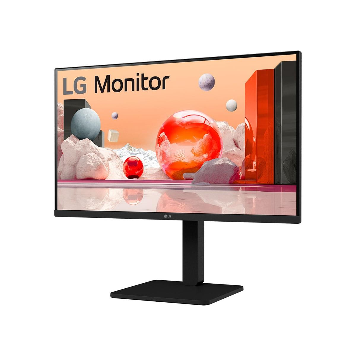 An LG monitor displaying an abstract scene with red spheres and rocks.