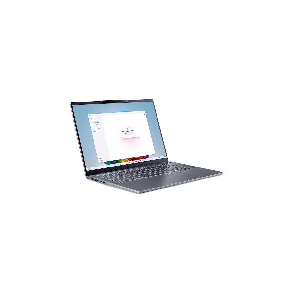 Un laptop grigio con uno schermo che mostra un messaggio di benvenuto.
