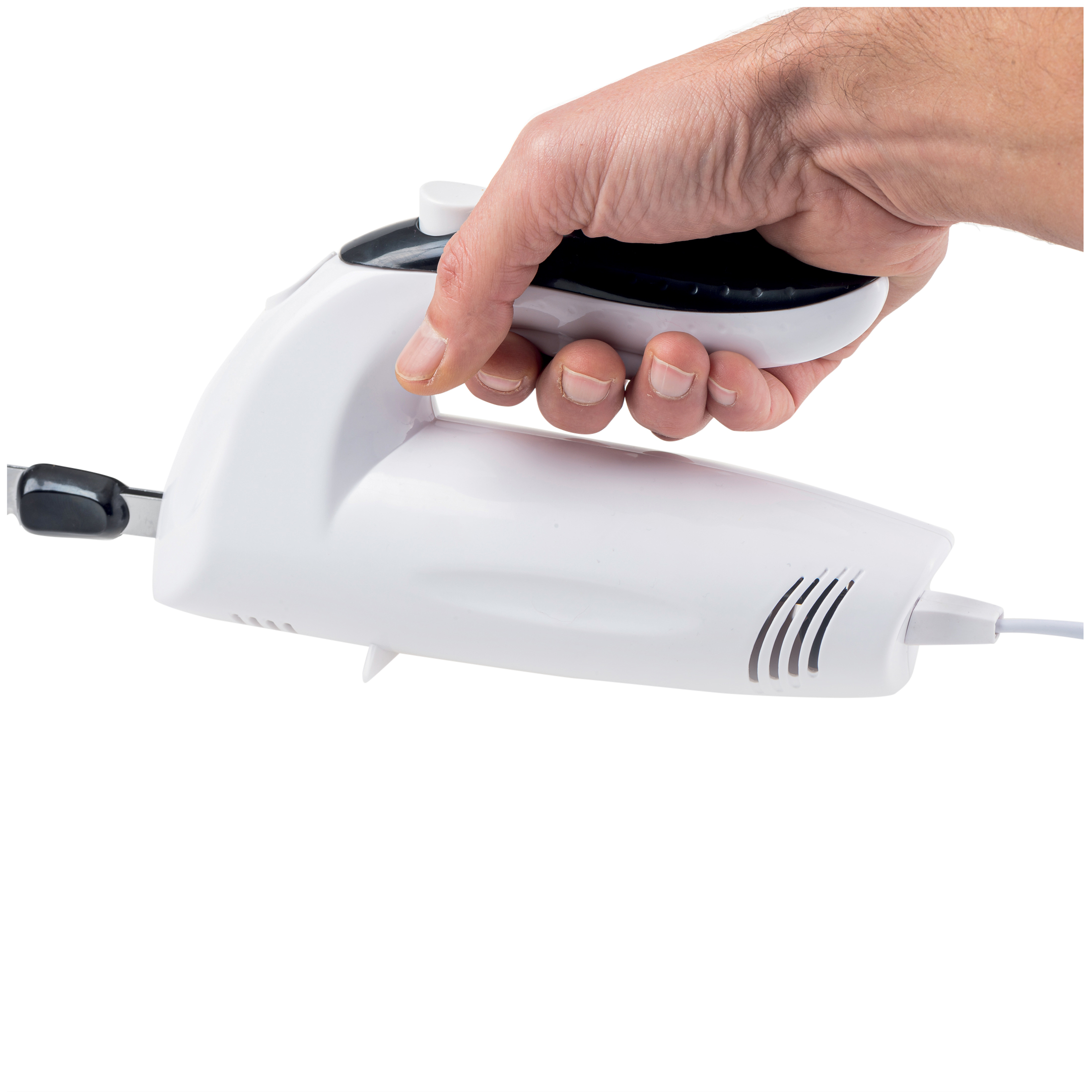 A hand holds a white electric knife with a black handle.