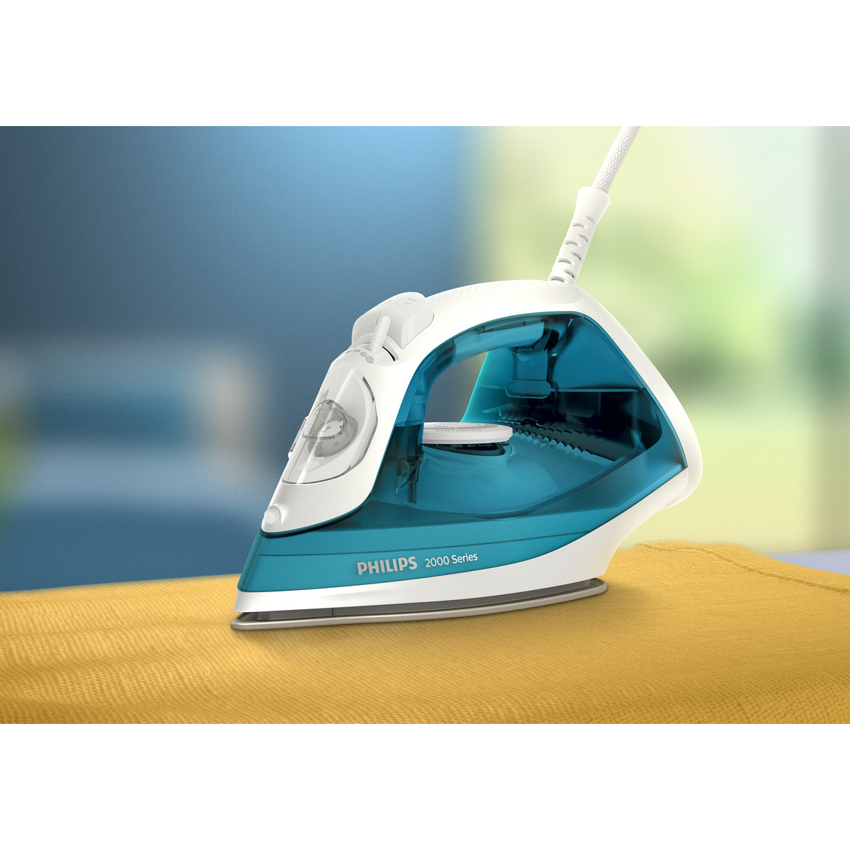 Una plancha de vapor Philips azul y blanca sobre una tela amarilla.