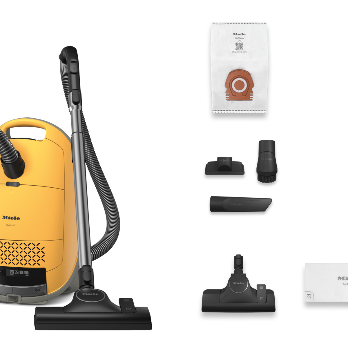 Aspirateur Miele jaune avec accessoires : sac, brosses, embouts.