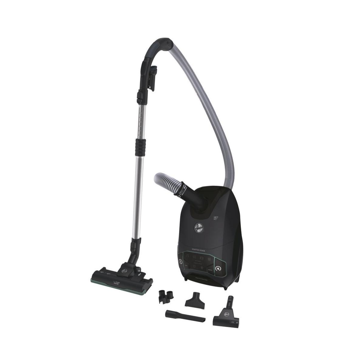 Una aspiradora Hoover negra con manguera, varita, cabezal de suelo y accesorios.