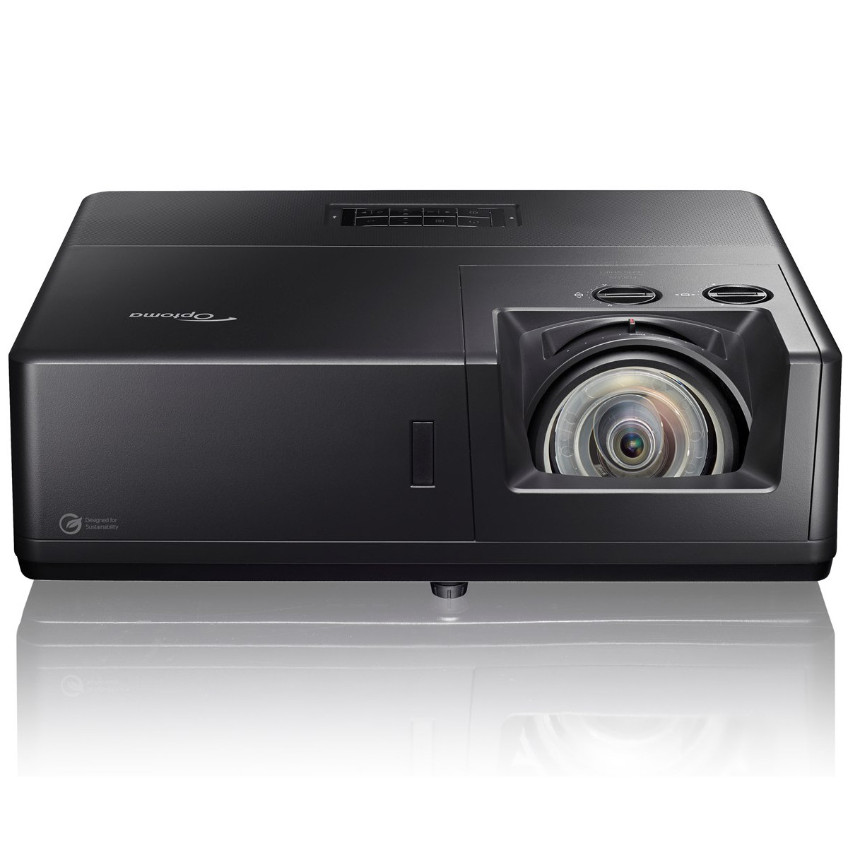 Proyector Optoma negro con lente grande y botones, reflejándose en superficie blanca.