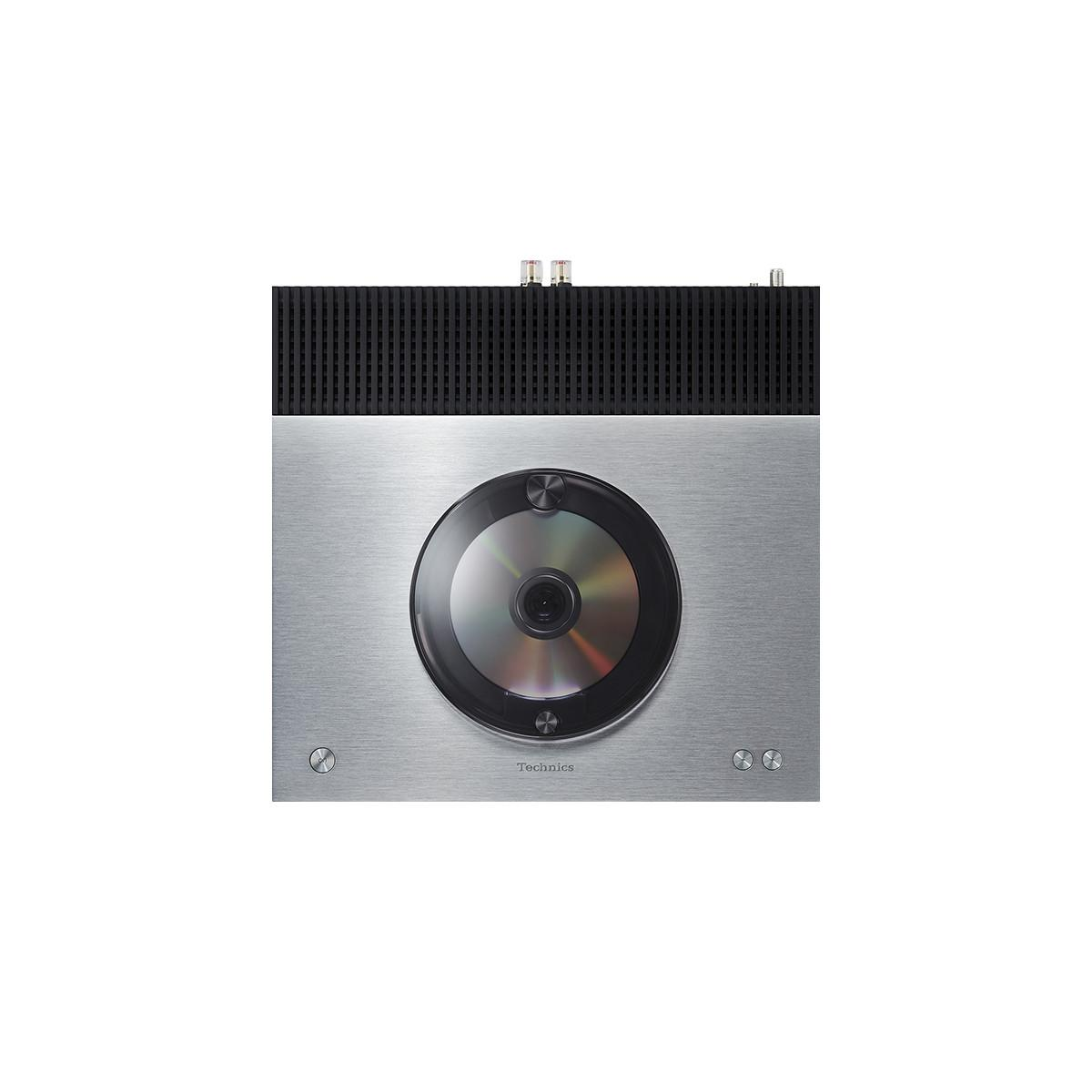 Silberner Technics CD-Player mit schwarzem oberen Gitter und sichtbarer CD.