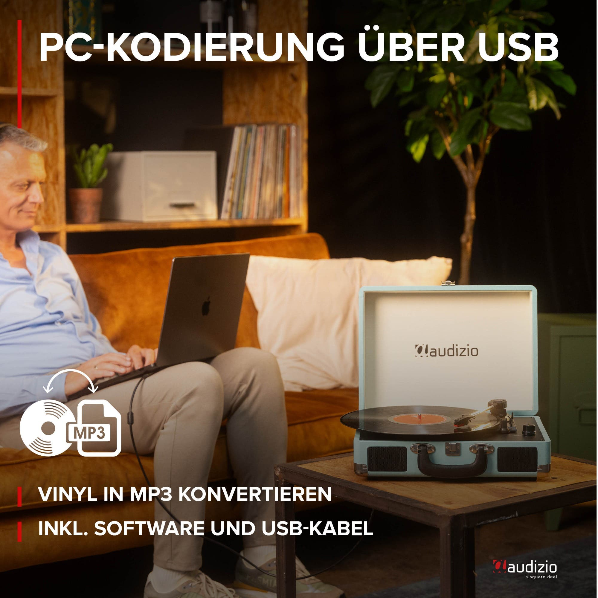 Mann konvertiert Vinyl zu MP3 über Laptop und Plattenspieler.