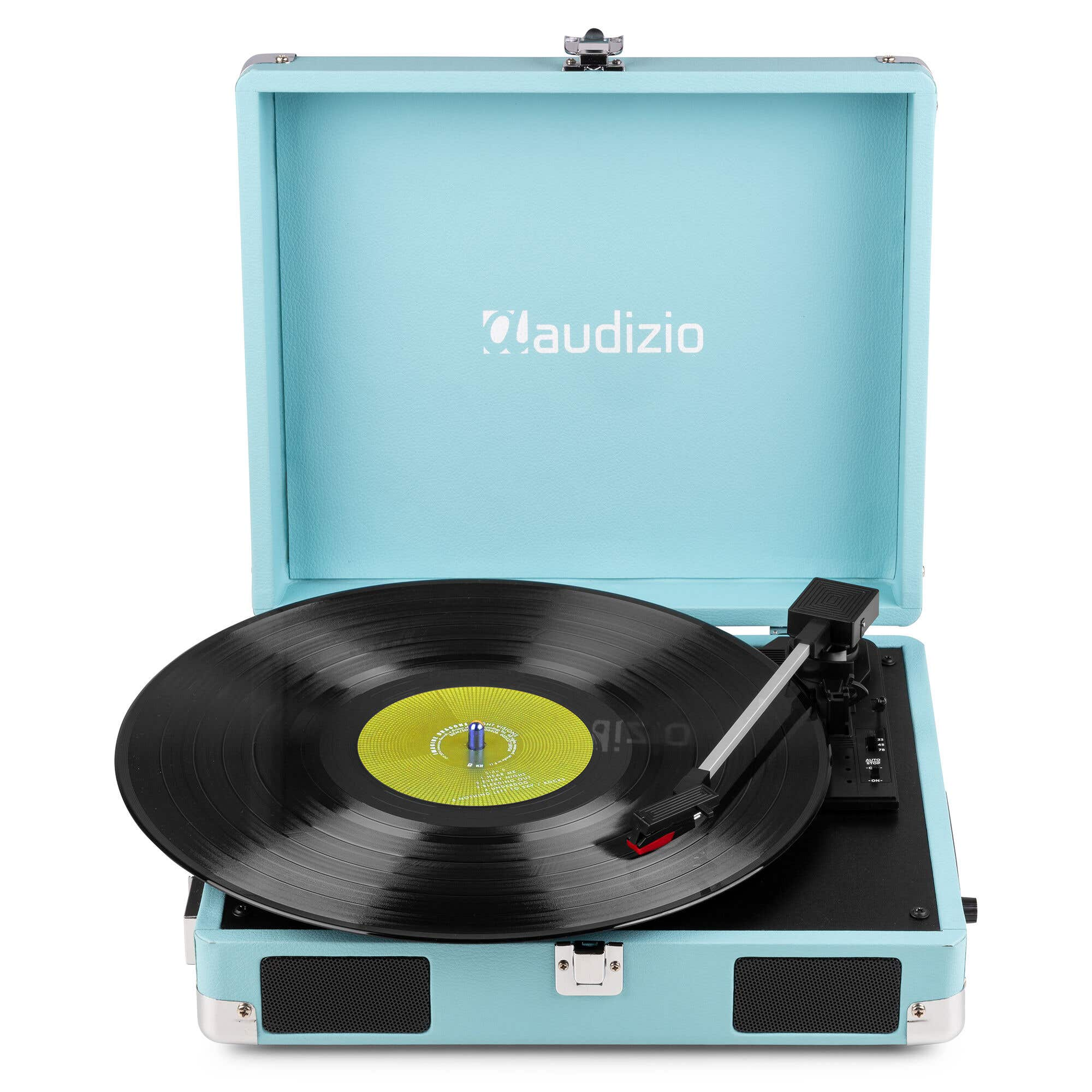 Un tocadiscos azul claro con un disco de vinilo negro y etiqueta amarilla.