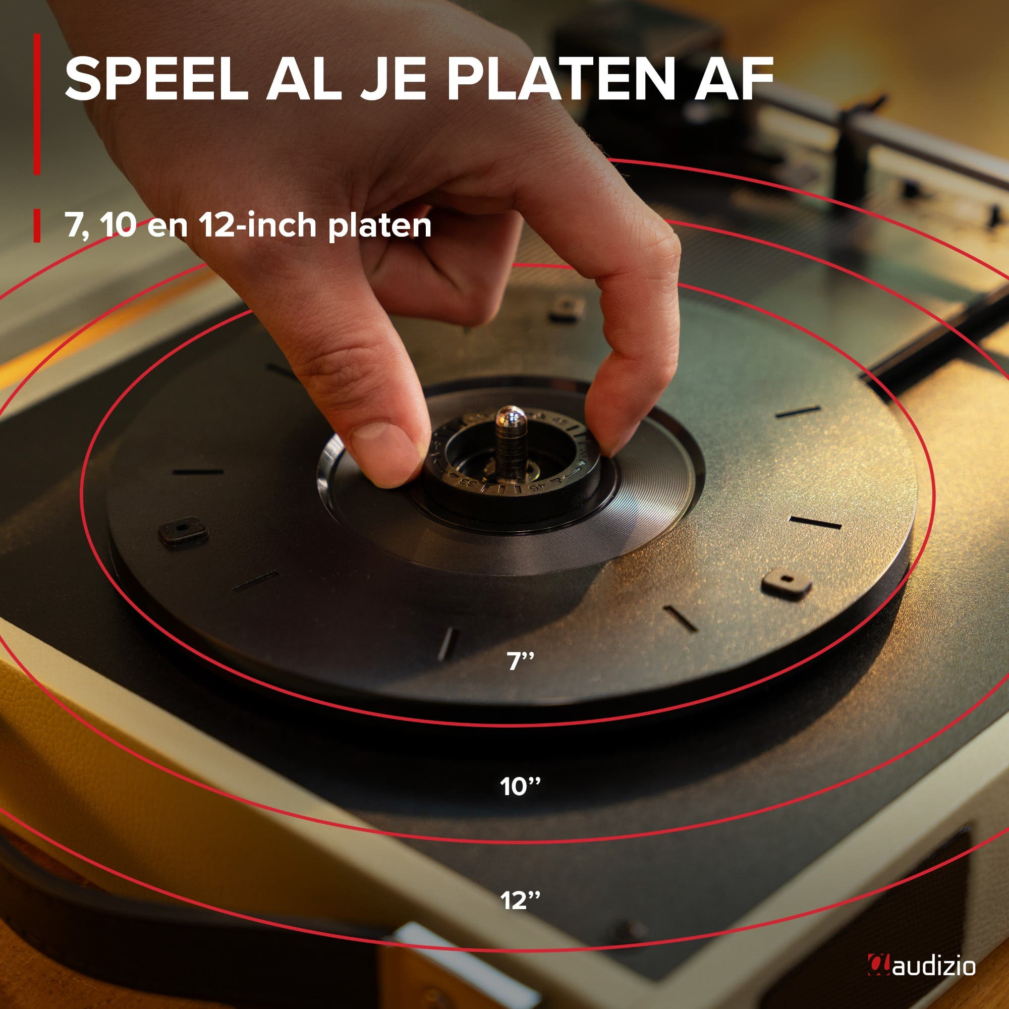 Hand places a record on a turntable, indicating 7, 10, and 12 inches.