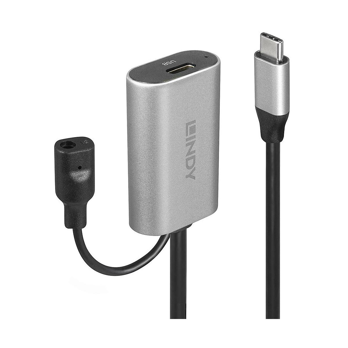 Silver USB-C adapter with USB-A port and black 3.5mm audio jack.