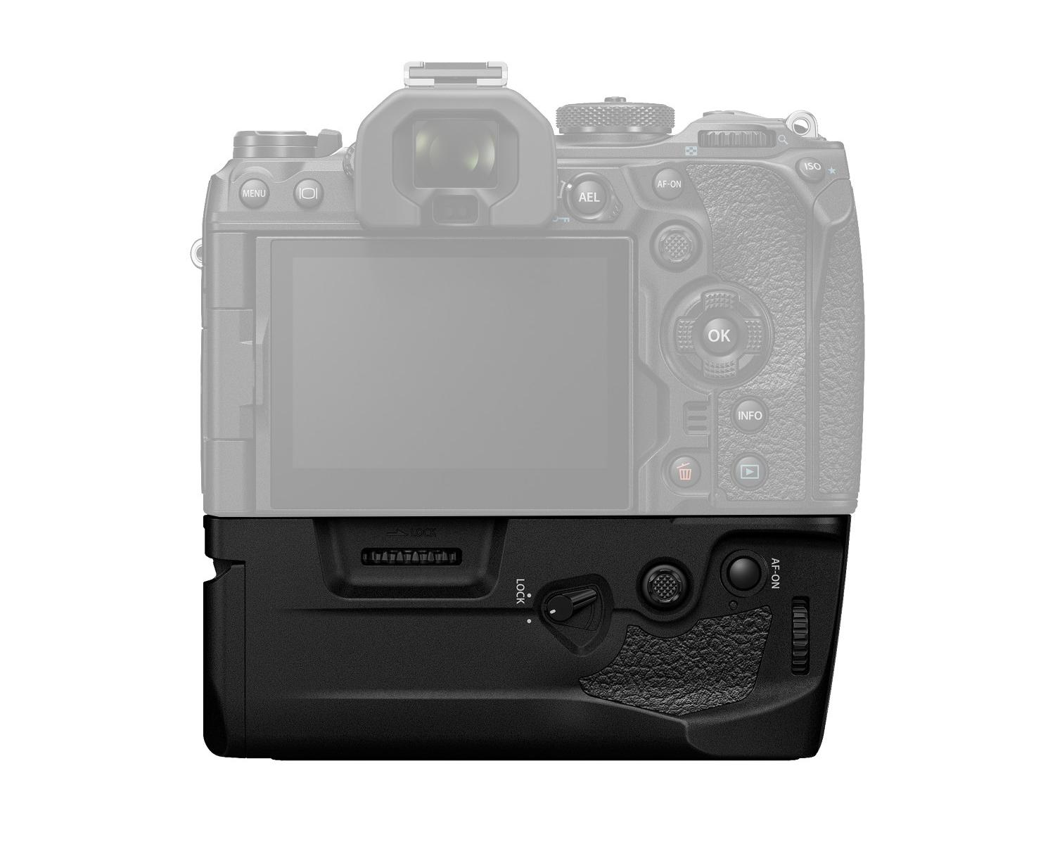 Rear view of a gray camera with a black battery grip and controls.