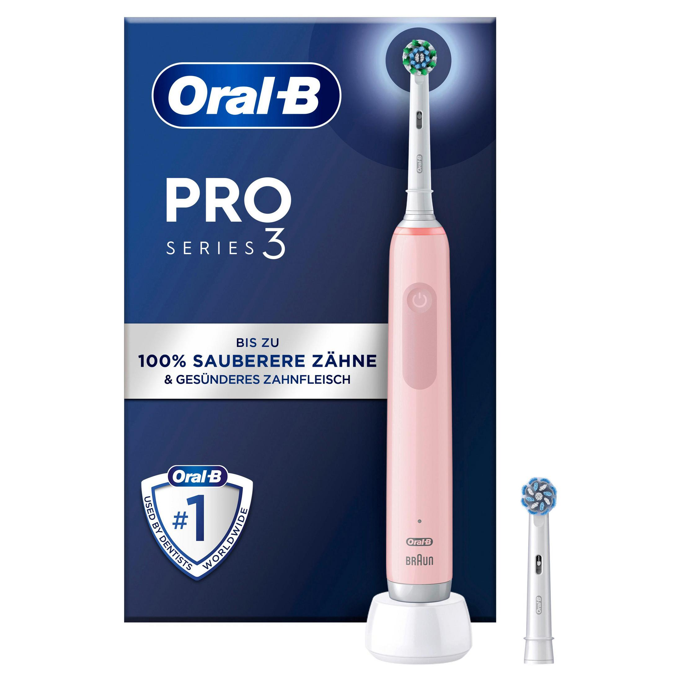 Un cepillo de dientes eléctrico Oral-B Pro Series 3 rosa con base de carga y cabezal.