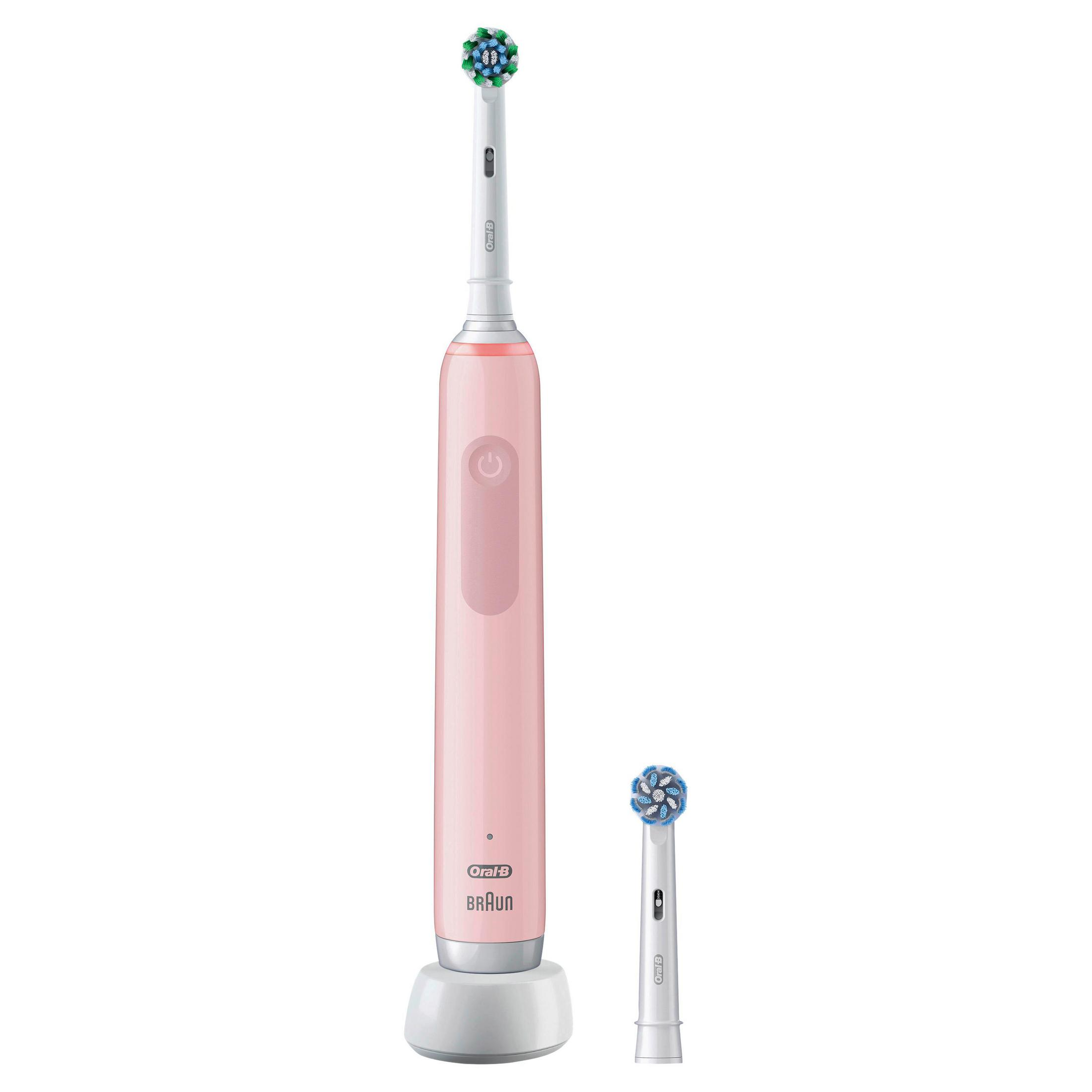 Un cepillo de dientes eléctrico rosa con mango blanco y base de carga.