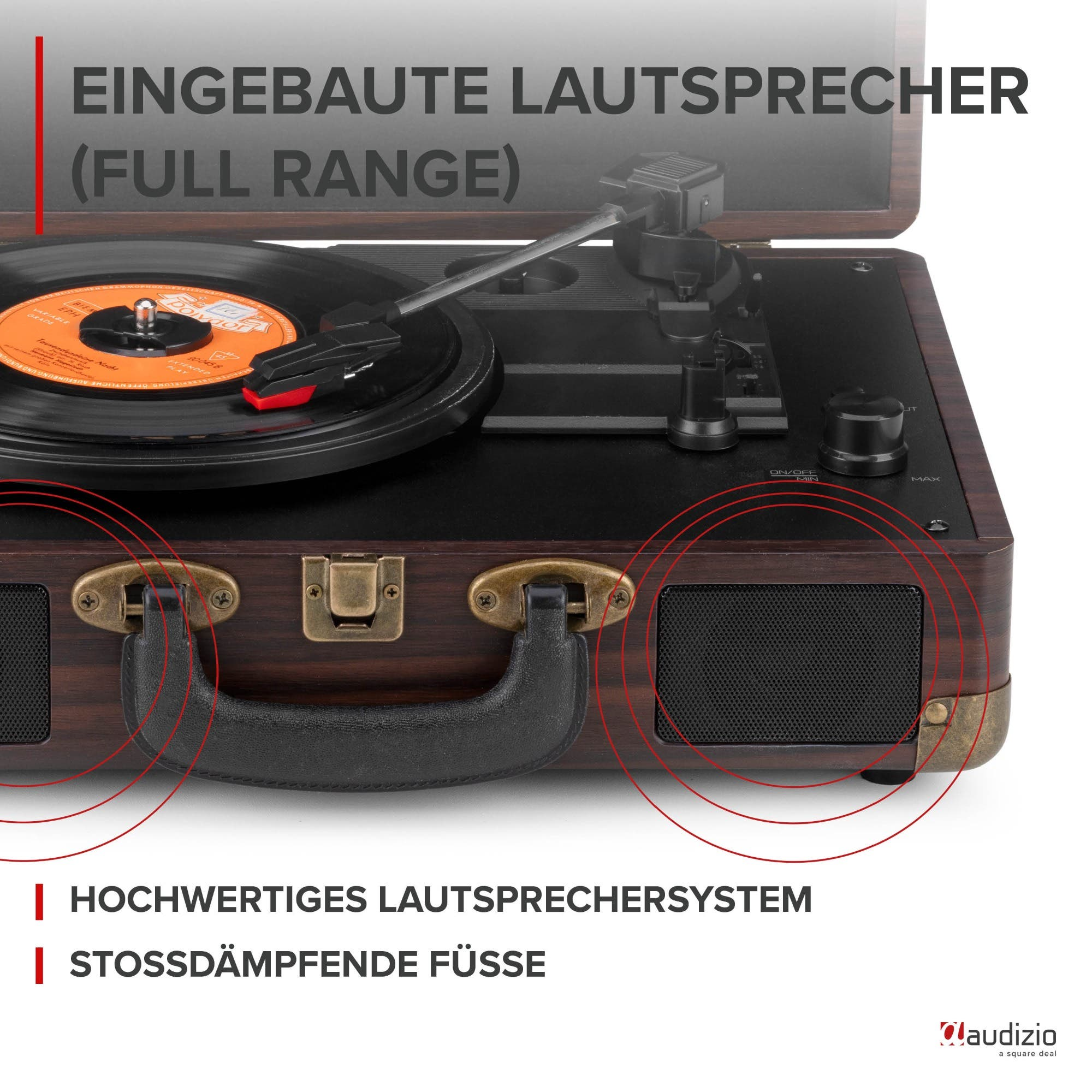 Ein Plattenspieler mit eingebauten Lautsprechern und Vinyl-Schallplatte.