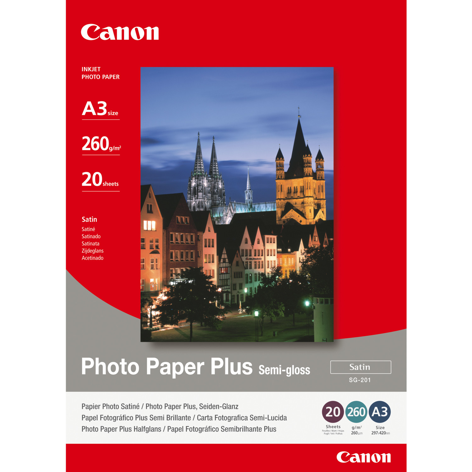 Canon Photo Paper Plus con vista della città di notte sullo sfondo.
