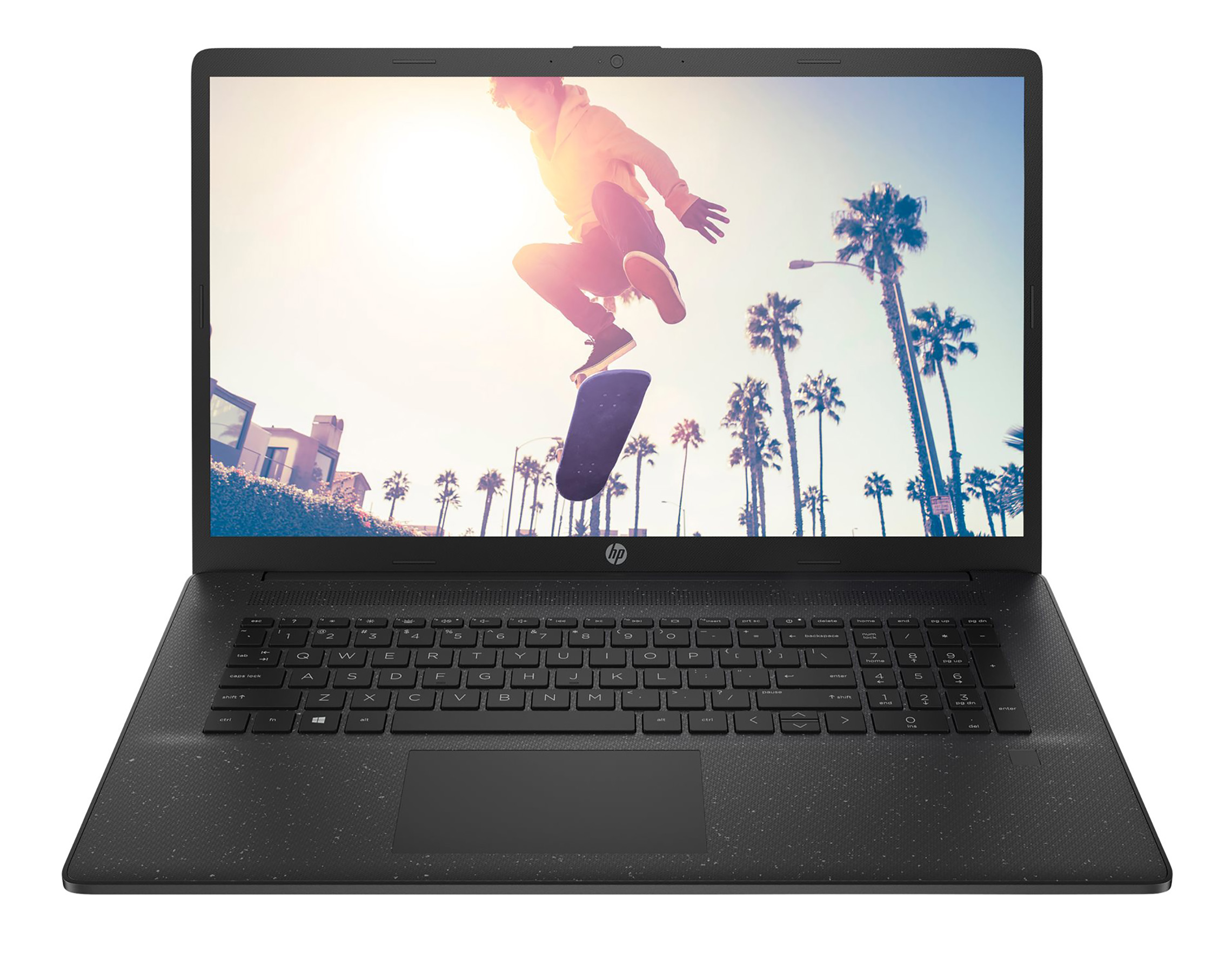 Ein Laptop zeigt einen Skateboarder, der in der Luft springt, Palmen und Gebäude.