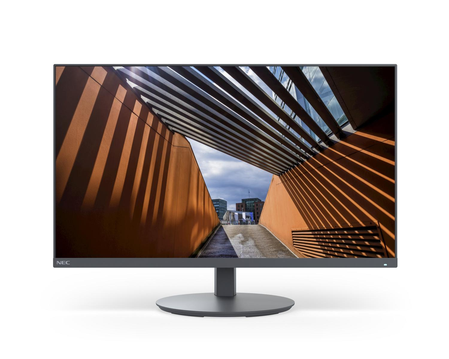 Un monitor mostra architettura moderna con giochi di luce e ombra ed edifici sullo sfondo.
