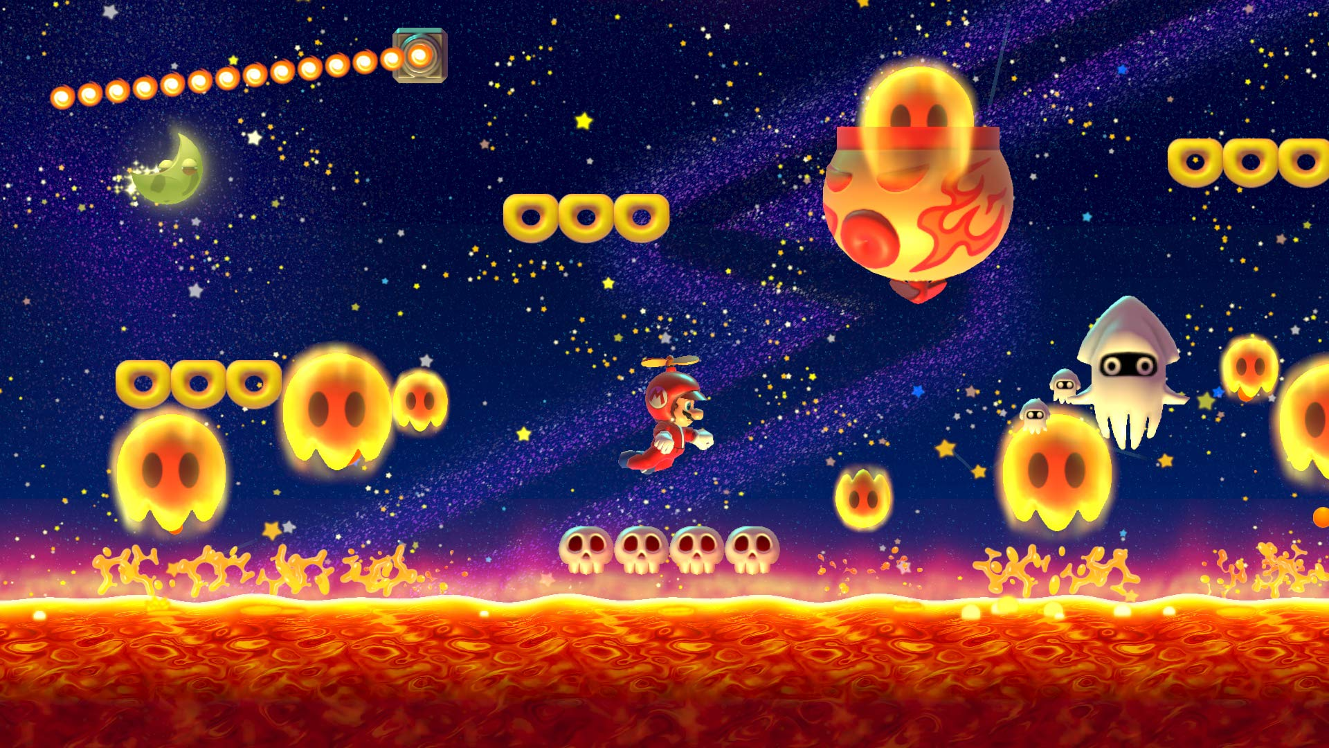 Mario in tuta rossa con cappello a elica vola contro un cielo notturno stellato.