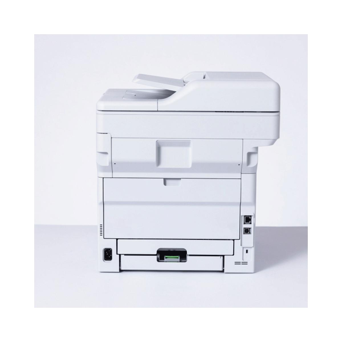 A white printer with an open paper tray and scanner top sits on a white surface.